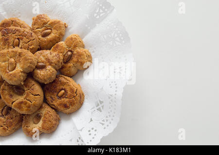 Traditional cookies with almond  presented in a tray on the left side Stock Photo