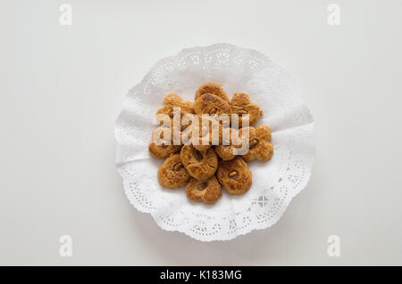 Traditional cookies with almond presented in a tray on white background Stock Photo