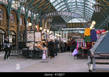 LONDON, UK - February 10: Famous Apple Market inside Covent Garden with people walking around and shopping in London, UK - February 10, 2015; The Appl Stock Photo