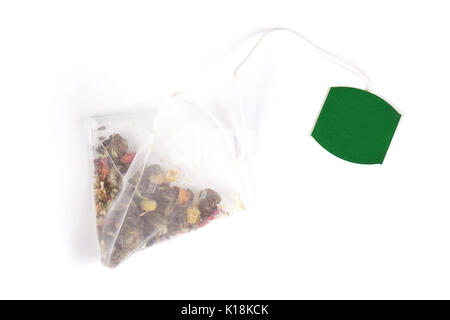 Herbal pyramid tea bag on white background Stock Photo