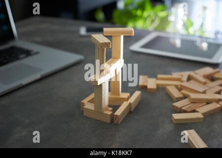 Brown wood building block tower with blur background .Selected focusing . Stock Photo