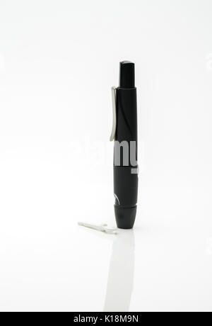Lancing pen device isolated on white background with copy space Stock Photo