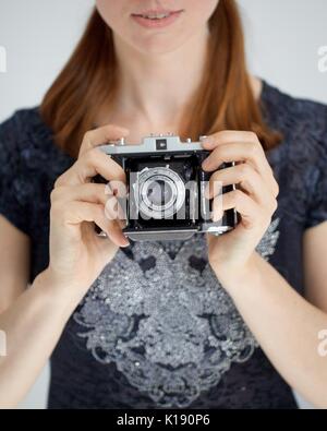Woman with a zeiss camera Stock Photo