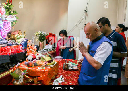 London, UK. 25th Aug, 2017. Devotees offer prayers and blessings as part  of the birthday celebrations to Lord Ganesha at the Laxmi Narayan temple in Hounslow . Ganesh Chaturthi  marks the day when Lord Ganesha known as the God of good beginnings, prosperity and obstacle remover was born on the fourth day of the Hindu Calendar Credit: amer ghazzal/Alamy Live News Stock Photo