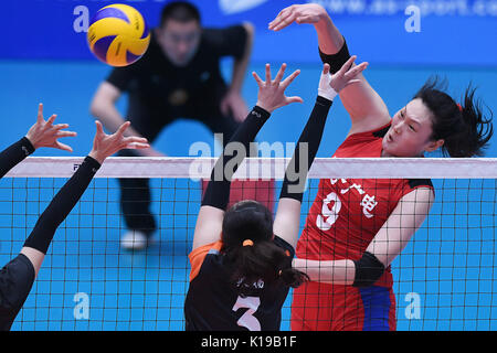 (170826) -- TIANJIN, Aug. 26, 2017 (Xinhua) -- Wang Yimei (R) of Liaoning spikes the ball during the quarterfinal match of women's volleyball between Liaoning and Fujian at the 13th Chinese National Games in north China's Tianjin Municipality, Aug. 26, 2017.(Xinhua/Huang Zongzhi) Stock Photo