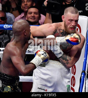 Las Vegas, Nevada, USA. 26th August, 2017. Las Vegas NV, USA. 26th Aug, 2017. ( IN blk-gld trunks) Floyd Mayweather Jr.goes 10 rounds with Conor McGregor Saturday at the T-Mobile arena in Las Vegas. Floyd Mayweather Jr. took the win by TKO as the fight was stop in the 10th round. This was Floyd's last fight ending it at 50 wins.Photos by Gene Blevins/LA DailyNews/SCNG/ZumaPress. Credit: Gene Blevins/ZUMA Wire/Alamy Live News Stock Photo