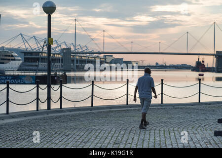 Silvertown, Newham, London, UK. 27th August 2017. UK Weather: Bright Bank holiday sunrise over London Docklands. A warm sunny day is expected. London Victoria dock with Excel exhibition centre and Sunborn Yacht hotel. Credit: WansfordPhoto/Alamy Live News Stock Photo