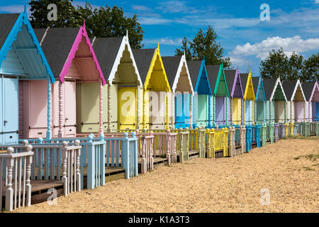 Row of colourful beach huts on Mersea Island, UK Stock Photo