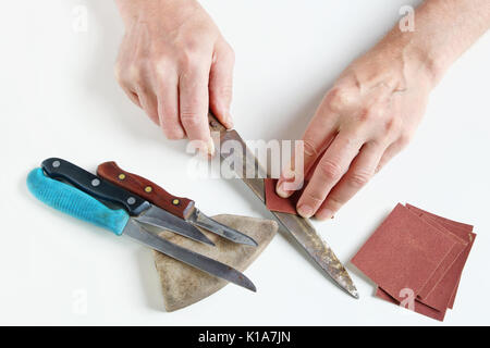 kitchen knife blade on grindstone Stock Photo - Alamy