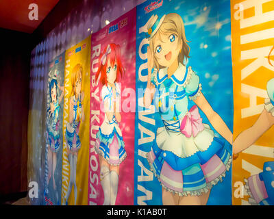 TOKYO, JAPAN - DECEMBER 28, 2011: Comic anime advertisement poster in central Tokyo. Anime abbreviation for animation is a popular trend in Japan and has a large audience and recognition world wide Stock Photo