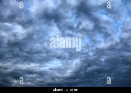 Fluffy clouds, heavily densed, covering the whole sky, giving it a bit of an artistic look Stock Photo