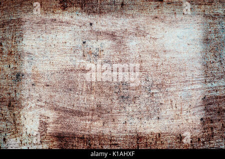 Old Damaged Wall Cracked Paint, Grunge Background, brown color. The texture of the brown paint on the old wall. Stock Photo