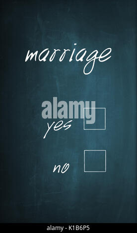 Conceptual text "Marriage" written with chalk on a dirty blackboard to select one of the empty yes or no selection boxes. Stock Photo