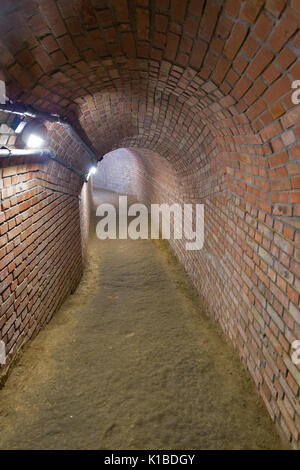 Underground brick path in the town of Przeszow, Poland Stock Photo