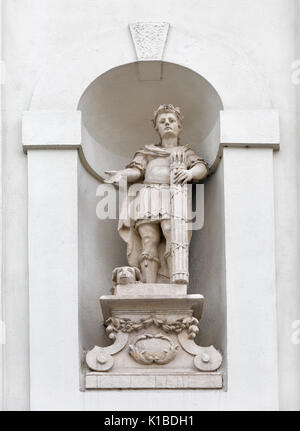 Church of the Holy Cross wall statue closeup in Rzeszow, Poland. Stock Photo