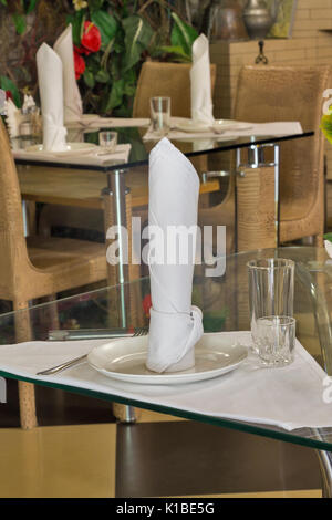 Interior of an old restaurant with old chairs and glass table. Stock Photo