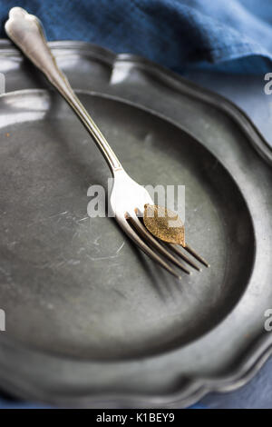 Autumnal table setting with golden autumn leave on concrete background Stock Photo