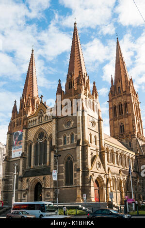 St Pauls Cathedral in Flinders Street, Melbourne, Victoria, Australia. A banner at upper left proclaims 'Let's Fully Welcome Refugees' Stock Photo