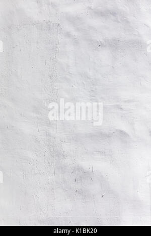bumpy plaster wall texture painted white as background Stock Photo