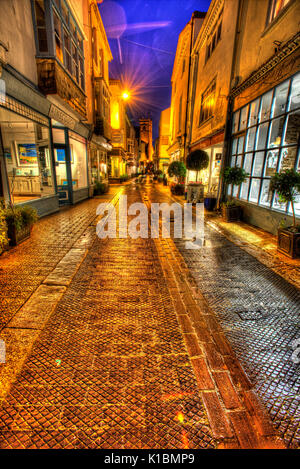 Town of Dartmouth, England. Picturesque night view of art and retails shops in Dartmouth’s Foss Street. Stock Photo