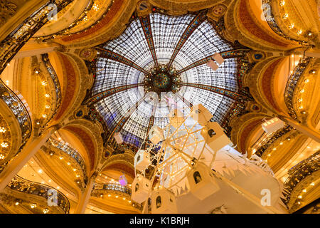Galleries Lafayette Haussman interior with glass cupola at Christmas. Paris, France Stock Photo