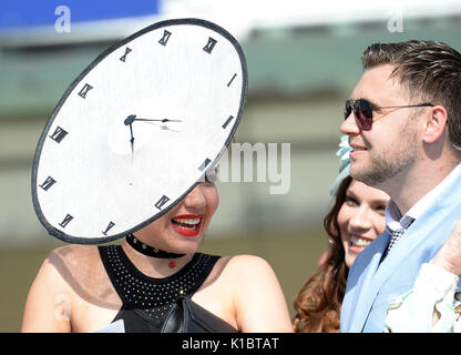 A racegoer wears an unusual hat during day four of the 2017 Yorkshire Ebor Festival at York Racecourse. Stock Photo