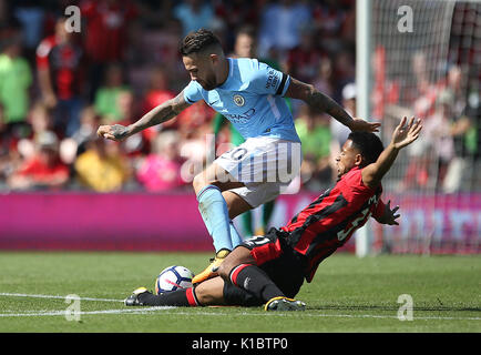 Manchester City's Nicolas Otamendi (left) and AFC Bournemouth Lys Mousset in action during the Premier League match at the Vitality Stadium, Bournemouth. Stock Photo