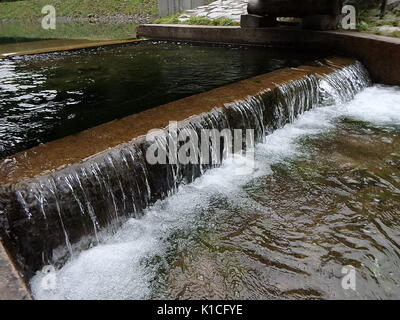 small waterfall, artificial cascade on the river, Stock Photo