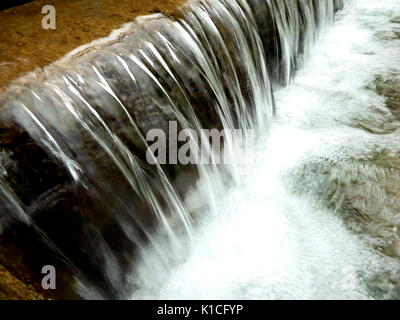 small waterfall, artificial cascade on the river, Stock Photo