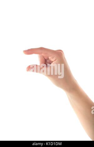 A gentle female hand is holding something with her right hand on isolated white background. Stock Photo