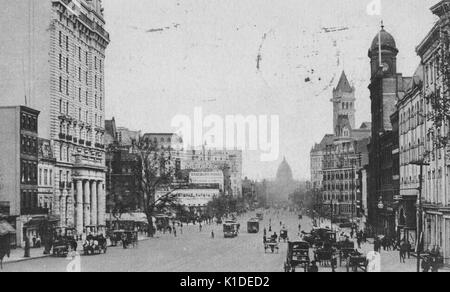 A partially colorized photograph of Pennsylvania Avenue, facing the Capitol Building, the street is populated by horse-drawn carriages and cars, people can be seen on the sides and walking in the street, Washington, DC, 1914. From the New York Public Library. Stock Photo