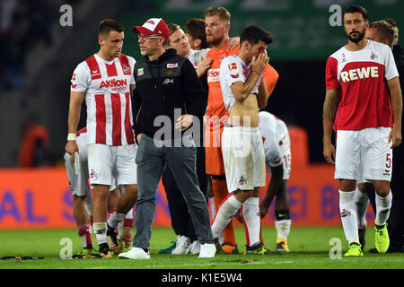 Cologne's coach Peter Stoeger leaves the field after losing the German Bundesliga soccer match between 1. FC Cologne and Hamburger SV in the RheinEnergieStadium in Cologne, Germany, 25 August 2017. Photo: Federico Gambarini/dpa Stock Photo