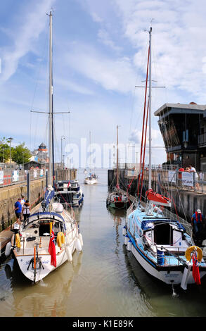 Bristol, UK. 26th August, 2017. Saturday 26th August 2017. Bank holiday weekend. Sailing boats leave Portishead Marina, Somerset, via the lock gates and head out into the Bristol Channel at the start of the Bank Holiday Weekend. All hoping to make the most of the good weather forecast for the UK over the holiday weekend. Credit: Stephen Hyde/Alamy Live News Stock Photo