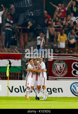 Budapest, Hungary. 26th Aug, 2017. BUDAPEST, HUNGARY - AUGUST 26: Adam Bodi (L2) of DVSC celebrates his goal with Janos Ferenczi #11 of DVSC and Akos Kinyik (R) of DVSC during the Hungarian OTP Bank Liga match between Budapest Honved and DVSC at Bozsik Stadium on August 26, 2017 in Budapest, Hungary. Credit: Laszlo Szirtesi/17�Թ����� Live News Stock Photo