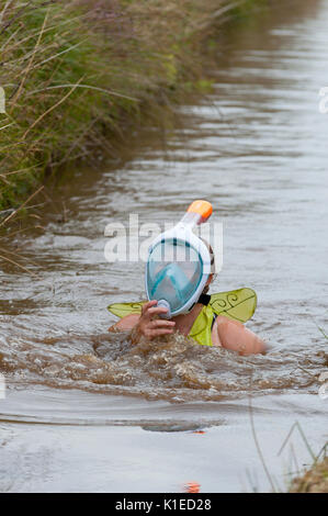 Llanwrtyd Wells, Powys, UK. 27th August, 2017. The 32nd annual World Bog Snorkelling Championships, conceived over 30 years ago in a Welsh pub by landlord Gordon Green, are held at the Waen Rhydd Bog. Using unconventional swimming strokes, participants swim two lengths of a 55 metre trench cut through a peat bog wearing snorkel mask and flippers. Credit:  Graham M. Lawrence/Alamy Live News Stock Photo