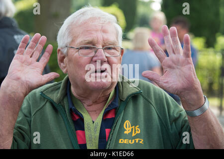Lauenforde, Germany. 27th Aug, 2017. Winfried Langner gesturing in Lauenforde, Germany, 27 August 2017. The pensioner known as Tractor Willi or Deutz Willi has returned from a recent four-month long trip to Saint Petersburg, Russia on board his tractor. Photo: Swen Pförtner/dpa/Alamy Live News Stock Photo