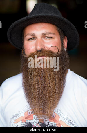Stuttgart, Germany. 27th Aug, 2017. Marc Bereiter, winner of the Swabian Beard Championships for everyone, poses during the brewery festival of the brewery 'Stuttgarter Hofbräu' in Stuttgart, Germany, 27 August 2017. Photo: Christoph Schmidt/dpa/Alamy Live News Stock Photo