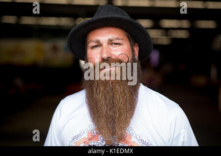Stuttgart, Germany. 27th Aug, 2017. Marc Bereiter, winner of the Swabian Beard Championships for everyone, poses during the brewery festival of the brewery 'Stuttgarter Hofbräu' in Stuttgart, Germany, 27 August 2017. Photo: Christoph Schmidt/dpa/Alamy Live News Stock Photo