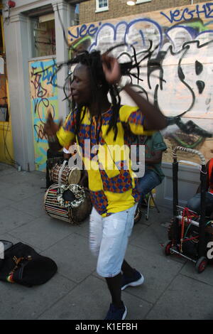 London, UK. 27th August 2017. The first full day of the Notting Hill Carnival takes place. This man is dancing to drums, one of the many attractions in Notting Hill's side-streets.. Roland Ravenhill/Alamy Live News. Stock Photo