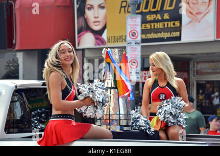Ottawa, Canada. 27th Aug, 2017. Ottawa Redblacks cheerleaders ride with the Grey Cup in the Ottawa Pride Parade. The team are the reigning Canadian Football League champions. Credit: Paul McKinnon/Alamy Live News