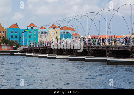 Willemstad, Curacao, Lesser Antilles.  Pedestrians Crossing Queen Emma Pontoon Bridge. Stock Photo