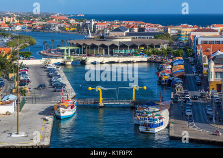 Willemstad, Curacao, Lesser Antilles.  Waaigat Lagoon (Bay), Floating Market Area on the right side of lagoon, Covered Central Market in Center Back. Stock Photo