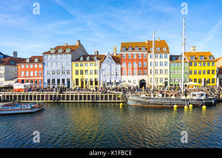 Copenhagen, Denmark - May 1, 2017: Nyhavn was originally a busy commercial port where ships from all over the world would dock. The area was packed wi Stock Photo