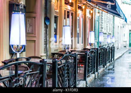 Quebec City, Canada - May 31, 2017: Old town street Rue Couillard with closeup of lights by tables of Portofino restaurant Stock Photo