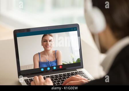 Man calling woman using video chat, virtual dating, distance rel Stock Photo