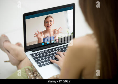 Two young women enjoying video call, app for virtual chat Stock Photo