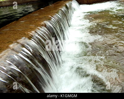 small waterfall, artificial cascade on the river, Stock Photo