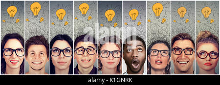 Group of young people men and women with many ideas light bulbs above head looking up. Stock Photo