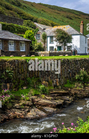 River Valency and river bank supported by a wall of slate stones, Boscastle, a village and fishing port on the north coast of Cornwall, England, UK Stock Photo