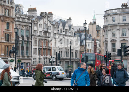 London, England. 06 march, 2016. Traffic and tourism in Trafalgar Square on a cloudy day. Stock Photo